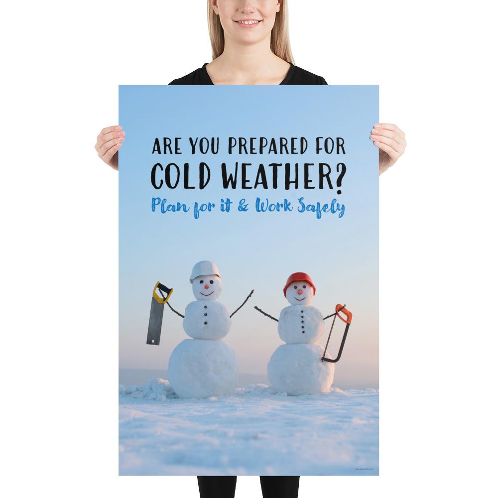 A safety poster showing two snowmen wearing hard hats and holding hand saws with the slogan are you prepared for cold weather? Plan for it and work safely.