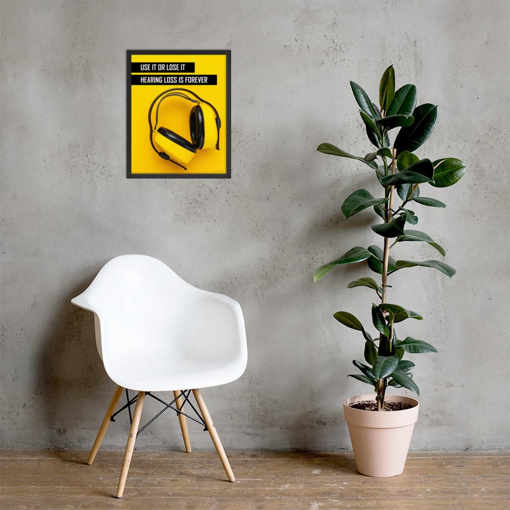 A hearing protection safety poster depicting bright yellow ear muffs on a bright yellow background in the bottom right corner with a bold safety slogan in the upper left corner.