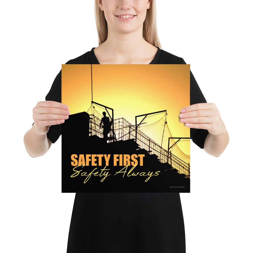 A workplace safety poster showing a construction site and construction workers being silhouetted by a bright and beautiful sunset of different shades of orange with the slogan safety first, safety always.