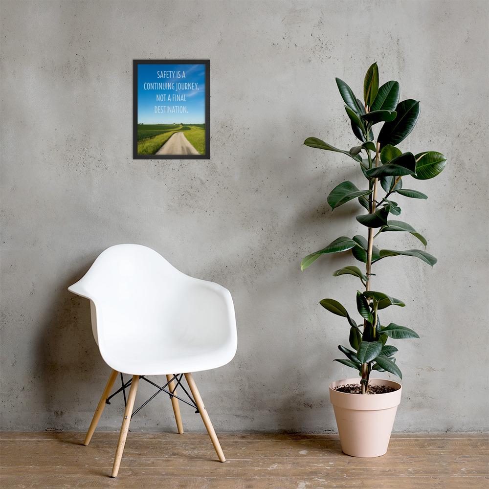 A workplace safety poster depicting a beautiful sunny day with a bright blue sky and a lush green field being cut down the middle by a dirt road leading off into the countryside with the text safety is a continuing journey, not a final destination.