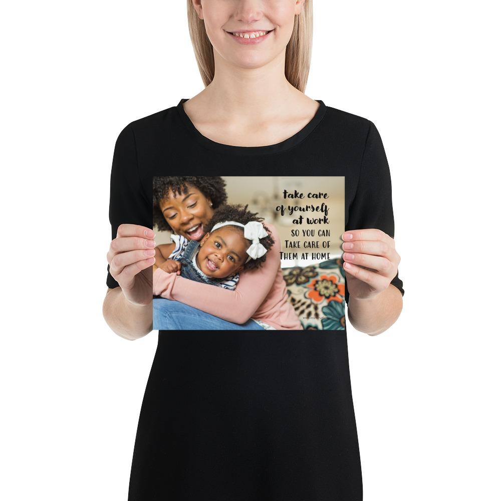 A safety poster showing a mother holding and playing with her young daughter at home with the slogan take care of yourself at work so you can take care of them at home.