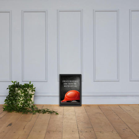 A workplace safety poster showing a bright red hard hat with an ominous black background with the slogan living with your mistakes is harder than you think, wear your safety gear.