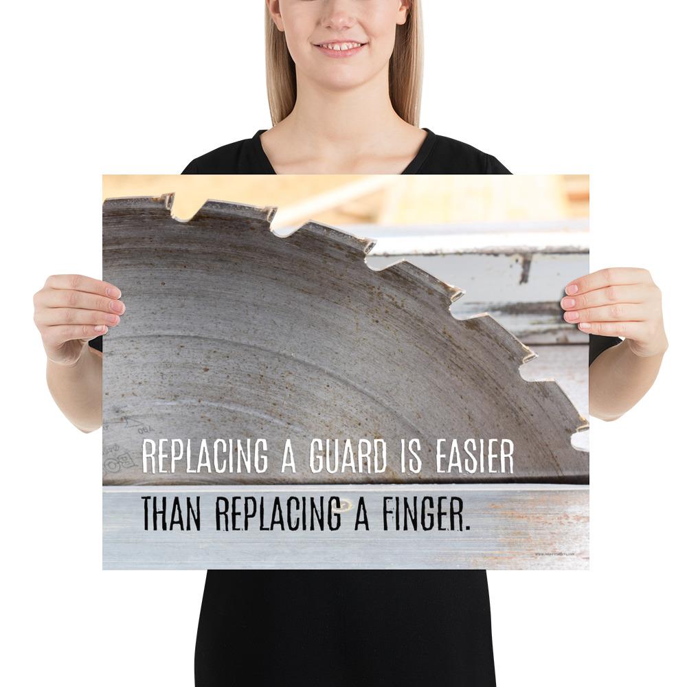 A workplace safety poster depicting a close up of a table saw blade in a workshop with a safety slogan on the bottom half of poster.