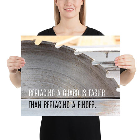 A workplace safety poster depicting a close up of a table saw blade in a workshop with a safety slogan on the bottom half of poster.
