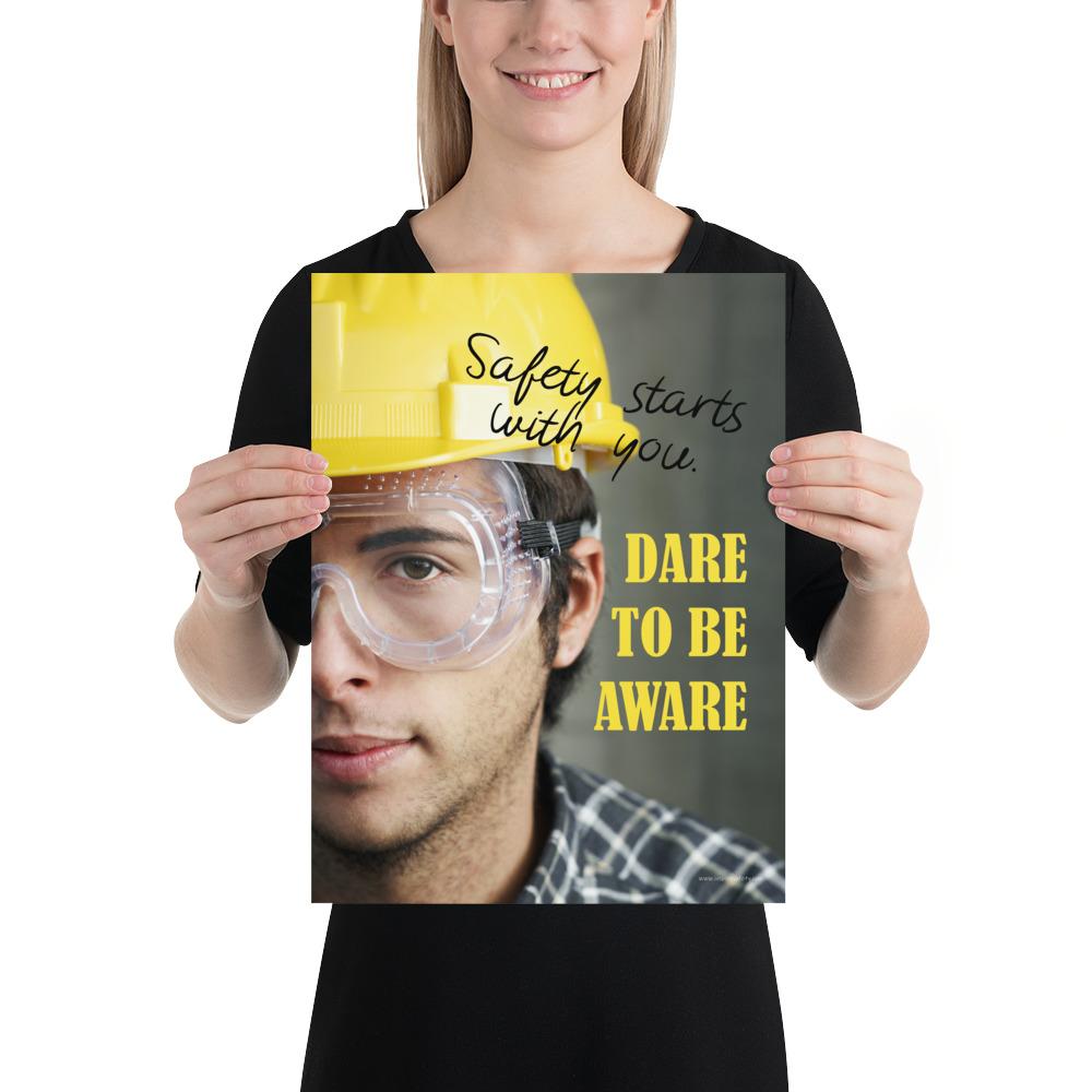 Safety poster showing a close up on half of a man's face wearing a yellow hard hat and safety glasses with text to the right.