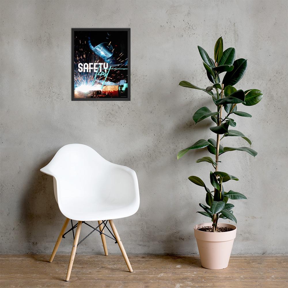 A safety poster showing a close-up of a welder welding a pipe while wearing a welding hood with bright sparks flying all around with the slogan safety first.