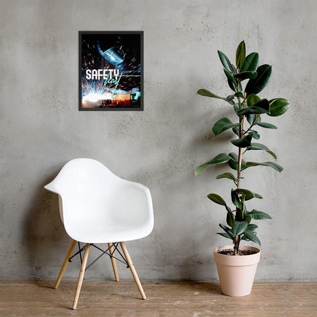 A safety poster showing a close-up of a welder welding a pipe while wearing a welding hood with bright sparks flying all around with the slogan safety first.