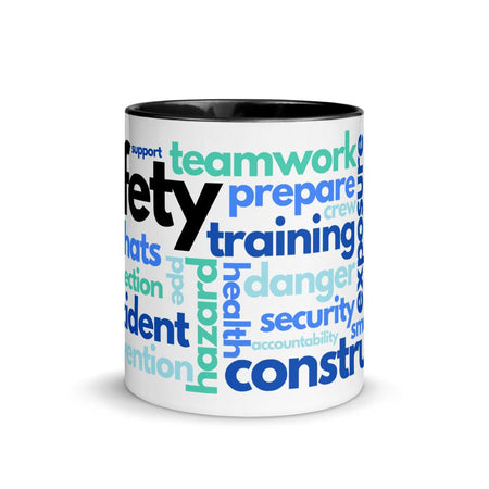White ceramic mug with safety terms like hard hats, protection, and encourage, in a various shades of blue across the mug with a black rim, inside, and handle.