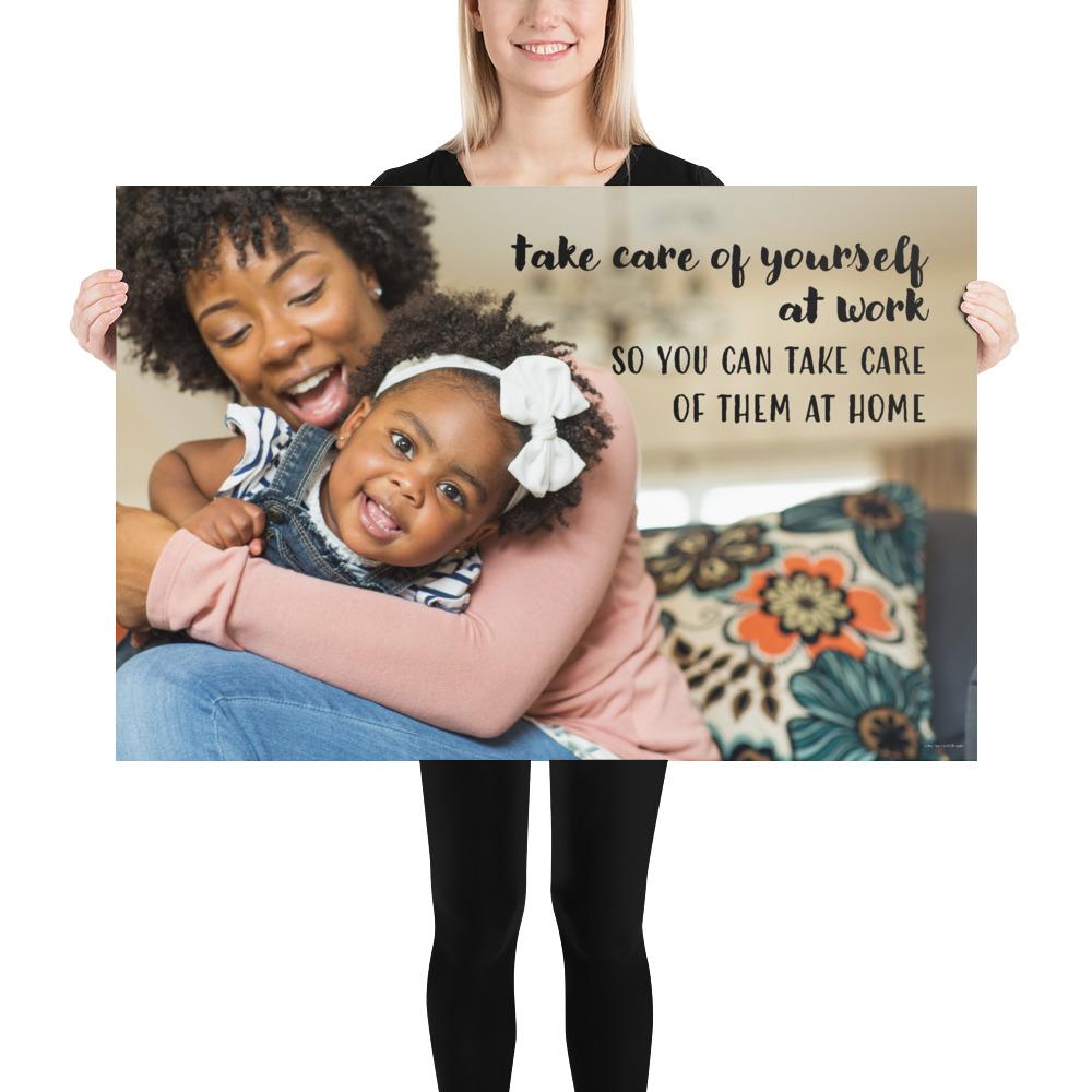 A safety poster showing a mother holding and playing with her young daughter at home with the slogan take care of yourself at work so you can take care of them at home.