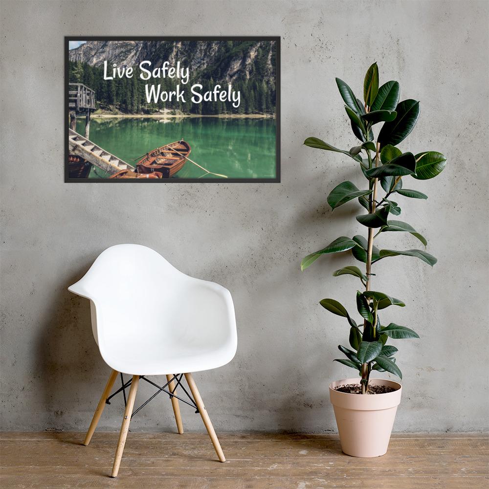 A workplace safety poster depicting a beautiful landscape of mountains in the background of a lake with a little wooden boat in the lake with text saying live safely work safely.