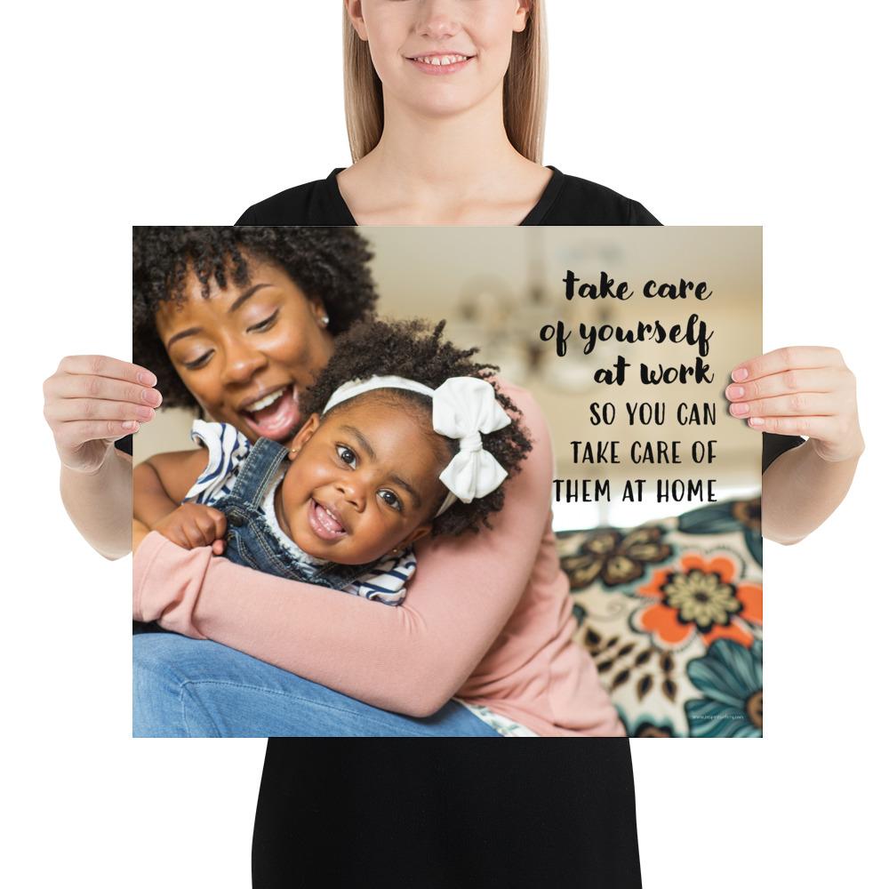 A safety poster showing a mother holding and playing with her young daughter at home with the slogan take care of yourself at work so you can take care of them at home.