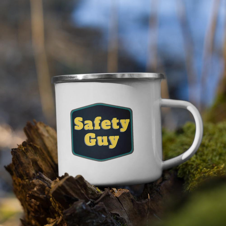 White metal mug with a silver rim with a navy emblem encasing bold yellow text that says "Safety Guy."