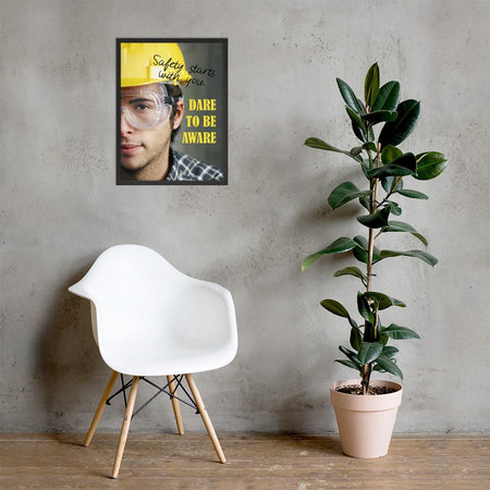 Safety poster showing a close up on half of a man's face wearing a yellow hard hat and safety glasses with text to the right.