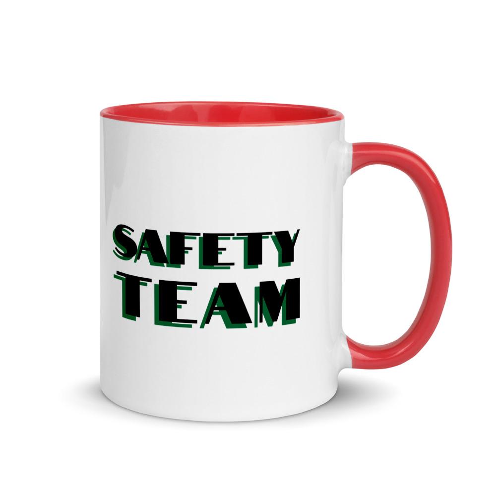 White ceramic mug with "Safety Team" in bold text across the side, with red color on the inside, the rim, and the handle.