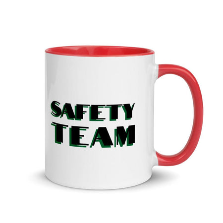 White ceramic mug with "Safety Team" in bold text across the side, with red color on the inside, the rim, and the handle.