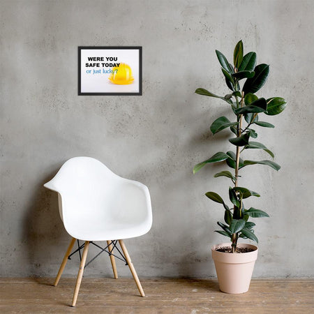 A workplace safety poster showing a yellow hard hat on a plain white background with the slogan were you safe today, or just lucky?