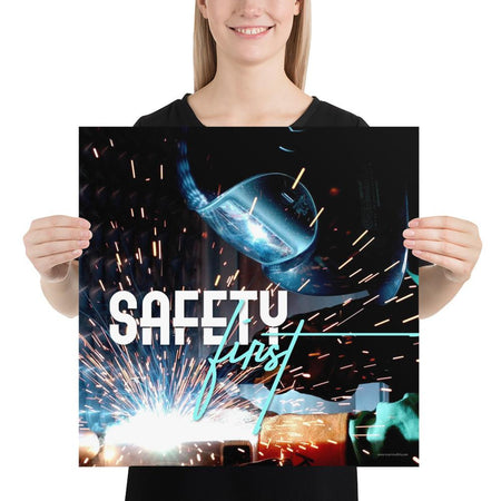 A safety poster showing a close-up of a welder welding a pipe while wearing a welding hood with bright sparks flying all around with the slogan safety first.