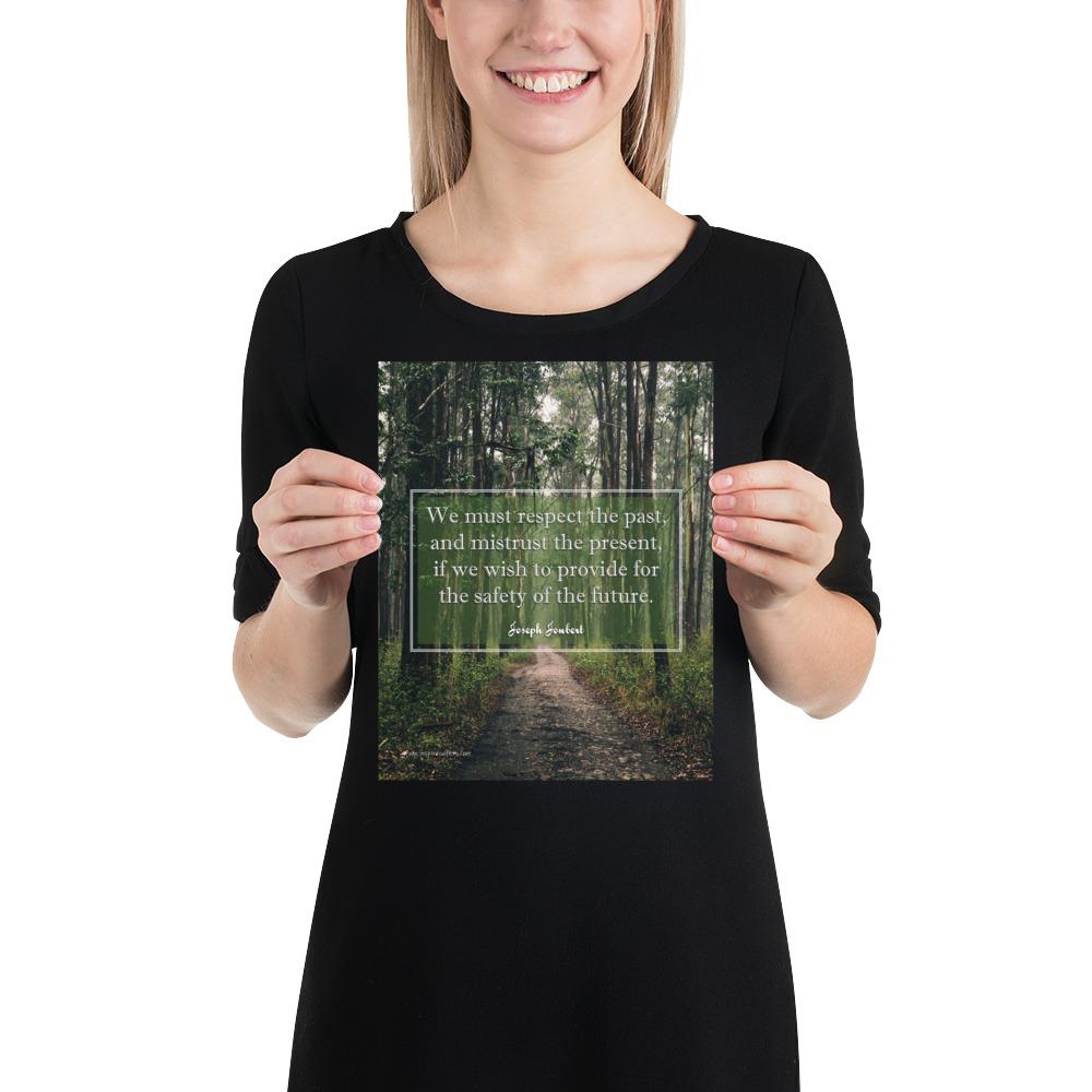 A workplace safety poster of a lush green forest with a footpath cutting directly in the middle winding down the forest with the a safety quote by Joseph Joubert centered on the poster.