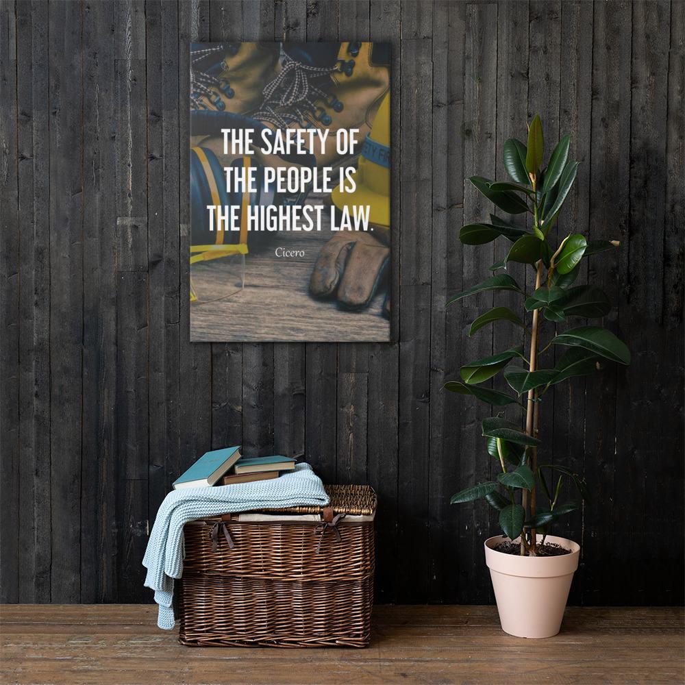 A safety poster showing a close-up of various PPE including safety glasses, ear muffs, gloves, a hard hat, and work boots with the quote by Cicero in the foreground.