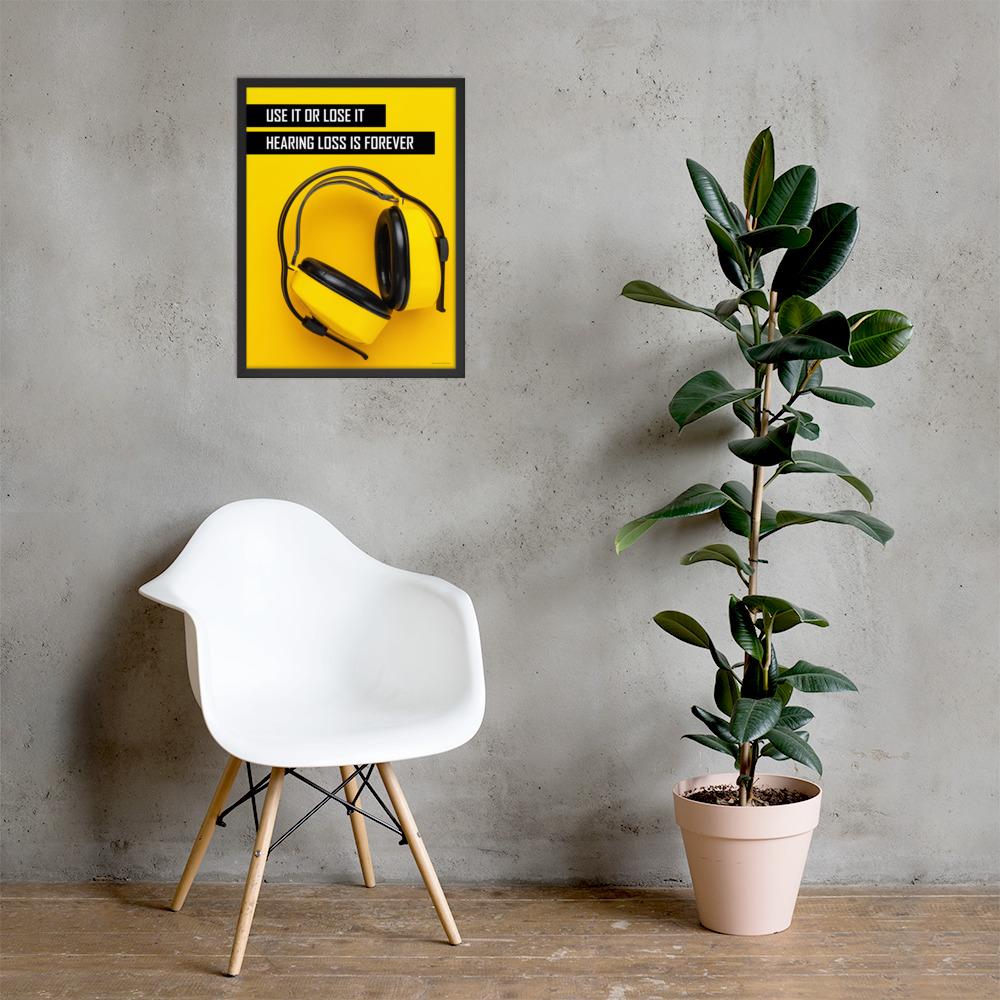 A hearing protection safety poster depicting bright yellow ear muffs on a bright yellow background in the bottom right corner with a bold safety slogan in the upper left corner.