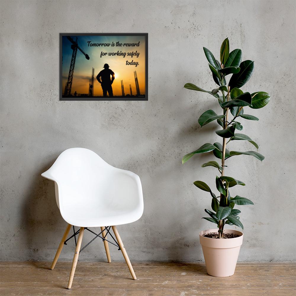 A safety poster showing a worker on a construction site being silhouetted by a sunset of orange and blue colors with the slogan tomorrow is the reward for working safely today.