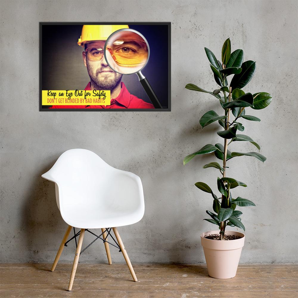 A workplace safety poster showing a portrait of a man wearing a hardhat and safety glasses with a magnifying glass magnifying one eye with the slogan, keep an eye out for safety, don't get blinded by bad habits.