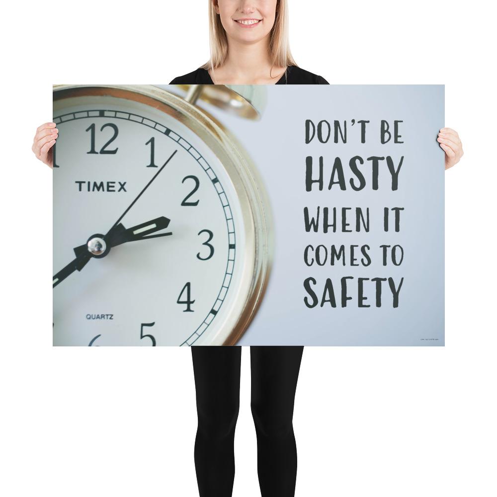 A workplace safety poster showing a close-up of a clock face with the slogan don't be hasty when it comes to safety.