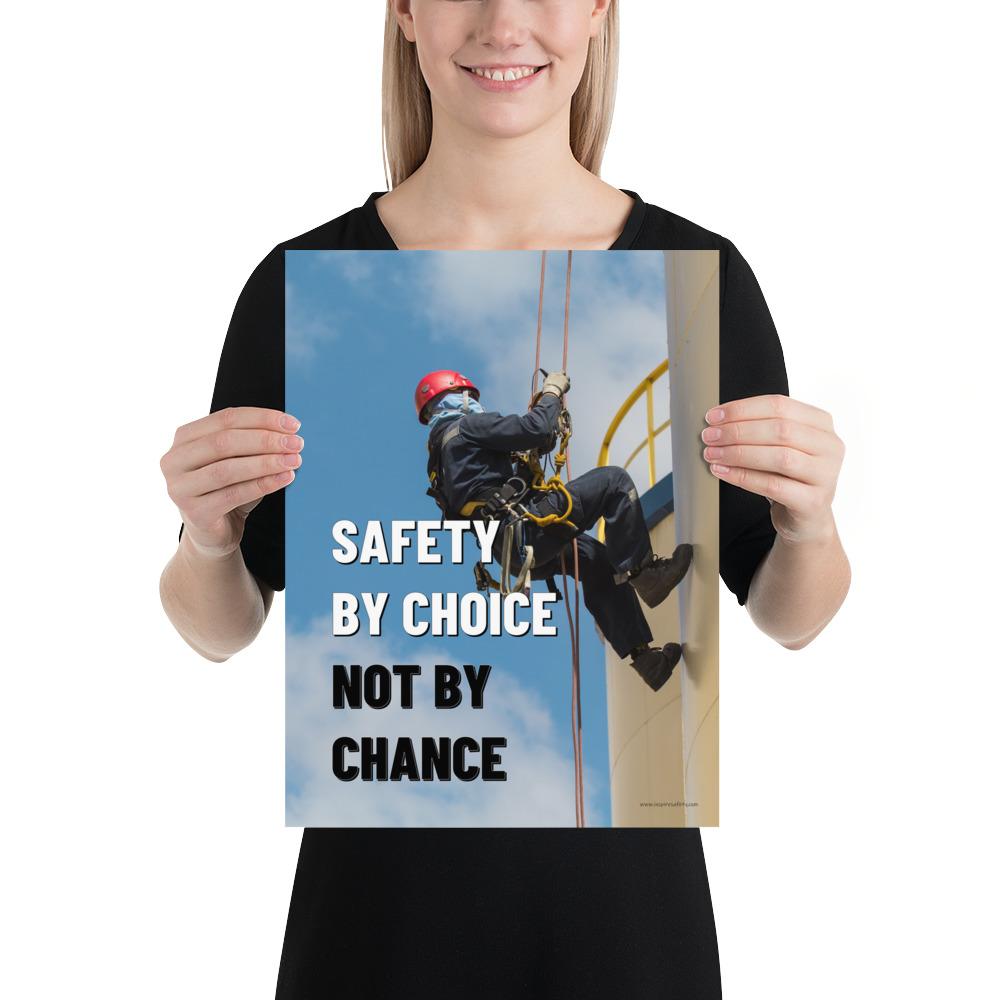A fully harnessed man wearing a hard hat scaling the side of a building with a bright blue sky and clouds in the background with the text safety by choice, not by chance in bold text to his left.