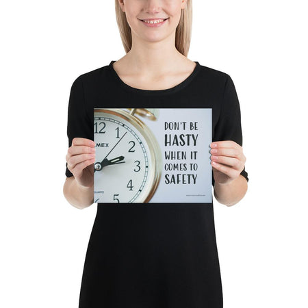A workplace safety poster showing a close-up of a clock face with the slogan don't be hasty when it comes to safety.