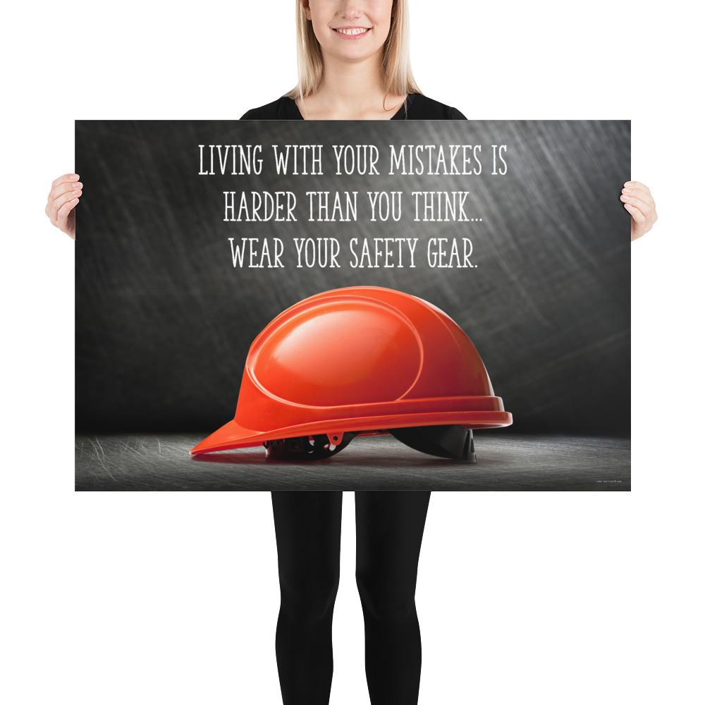 A workplace safety poster showing a bright red hard hat with an ominous black background with the slogan living with your mistakes is harder than you think, wear your safety gear.