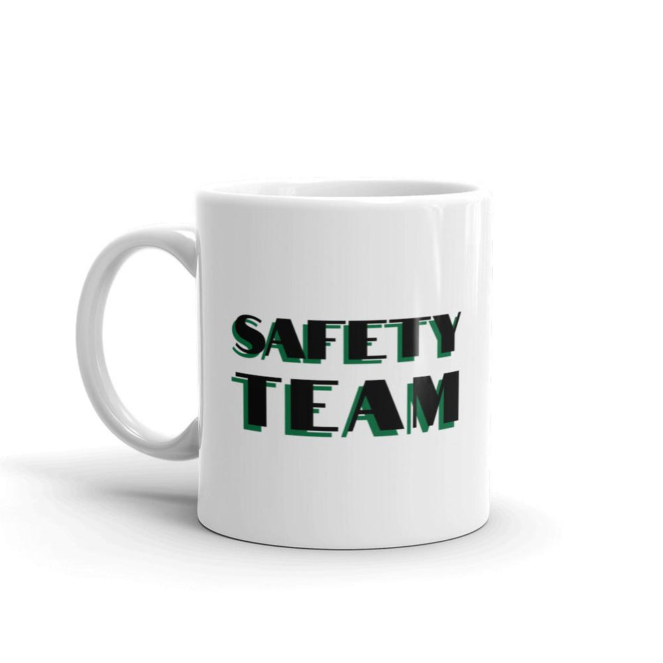 White ceramic mug with "Safety Team" in bold text across the side.