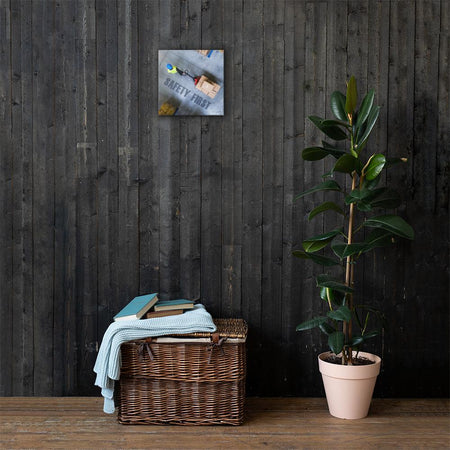 A safety poster showing a bird's-eye view of a worker in a warehouse pulling boxes on a pallet jack with the slogan safety first in bold letters.