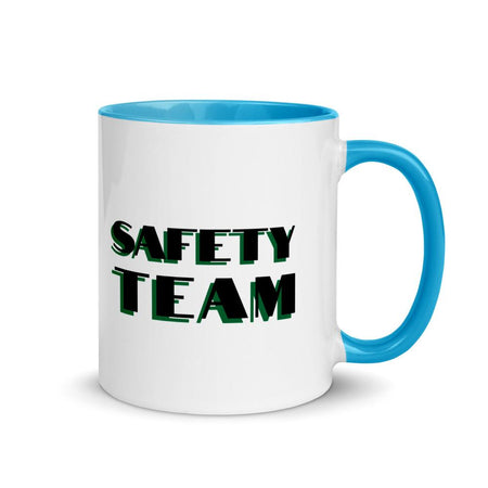 White ceramic mug with "Safety Team" in bold text across the side, with blue color on the inside, the rim, and the handle.