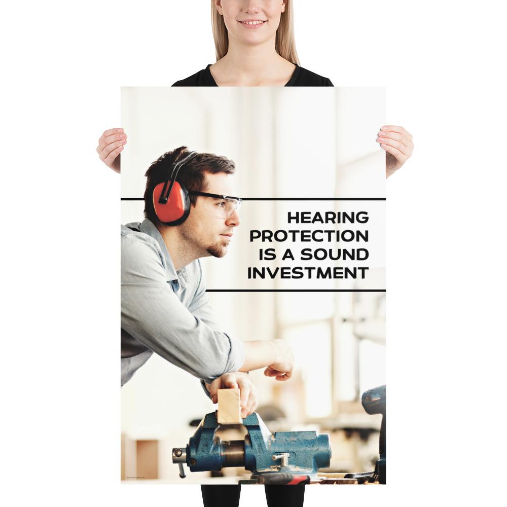 A workplace safety poster of a man in safety glasses and earmuffs taking a break in his woodshop with a safety slogan to the right.
