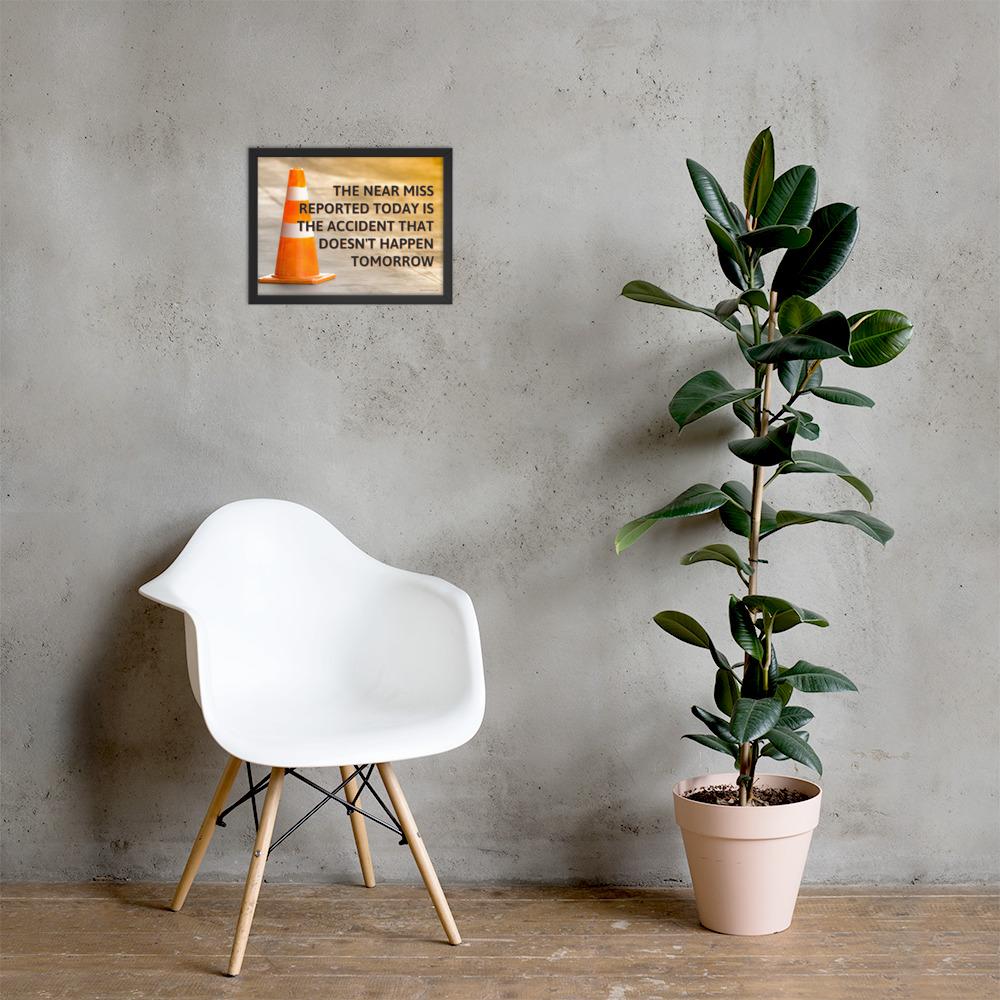 A workplace safety poster showing an orange safety cone with the slogan the near miss reported today is the accident that doesn't happen tomorrow.