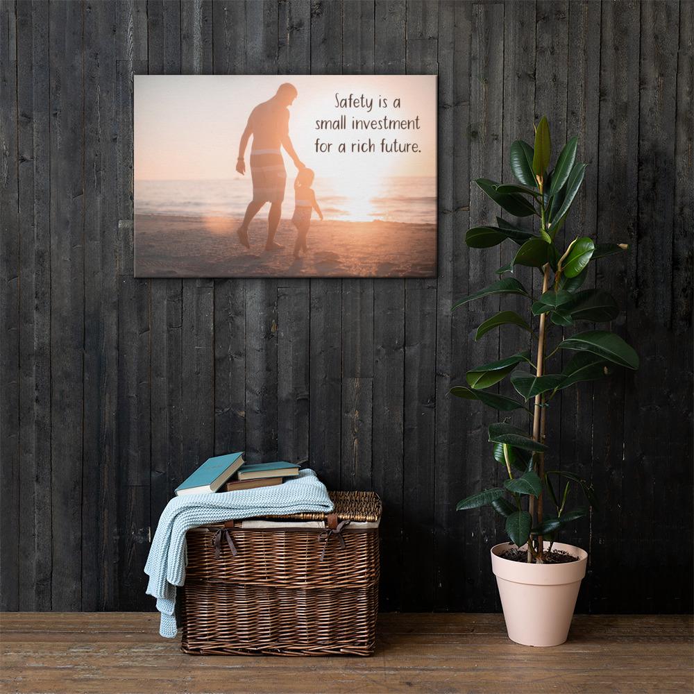 A workplace safety poster showing a father and his young daughter walking on the shore of a beach with a beautiful sunset in the background and text saying safety is a small investment for a rich future.