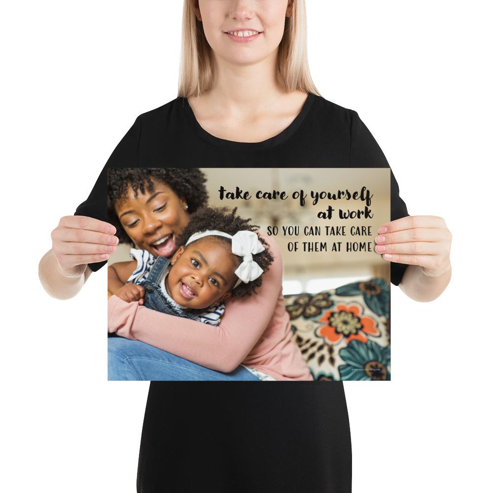 A safety poster showing a mother holding and playing with her young daughter at home with the slogan take care of yourself at work so you can take care of them at home.