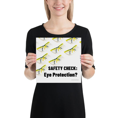 An eye safety poster depicting many clear safety glasses with yellow trim neatly lined up in rows and rows with a safety slogan in the foreground.