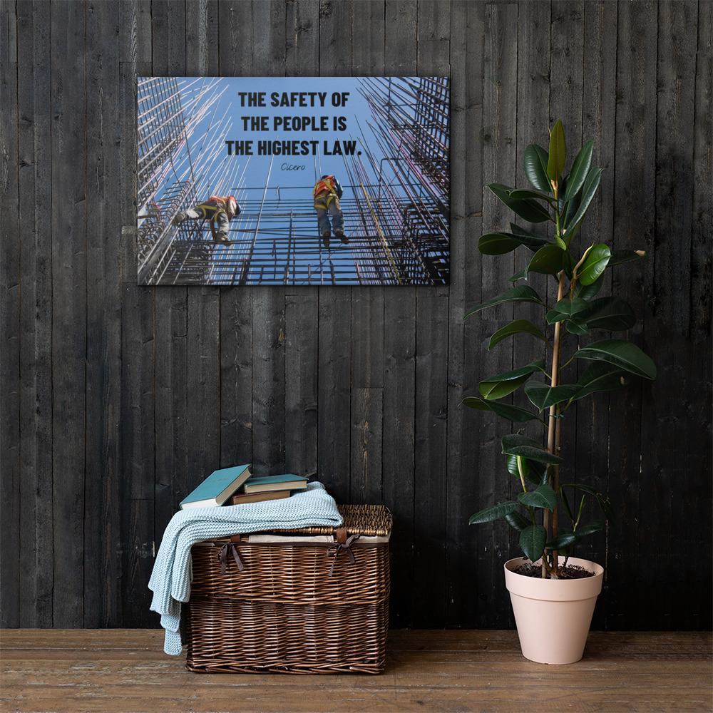A safety poster showing construction workers scaling rebar with a bright blue sky as the background and a safety quote in black block text.