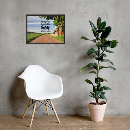 A workplace safety poster showing a beautiful sunny day in the countryside with a red barn on the right of a dirt road and text above the road saying my job provides the paycheck but safety takes me home.