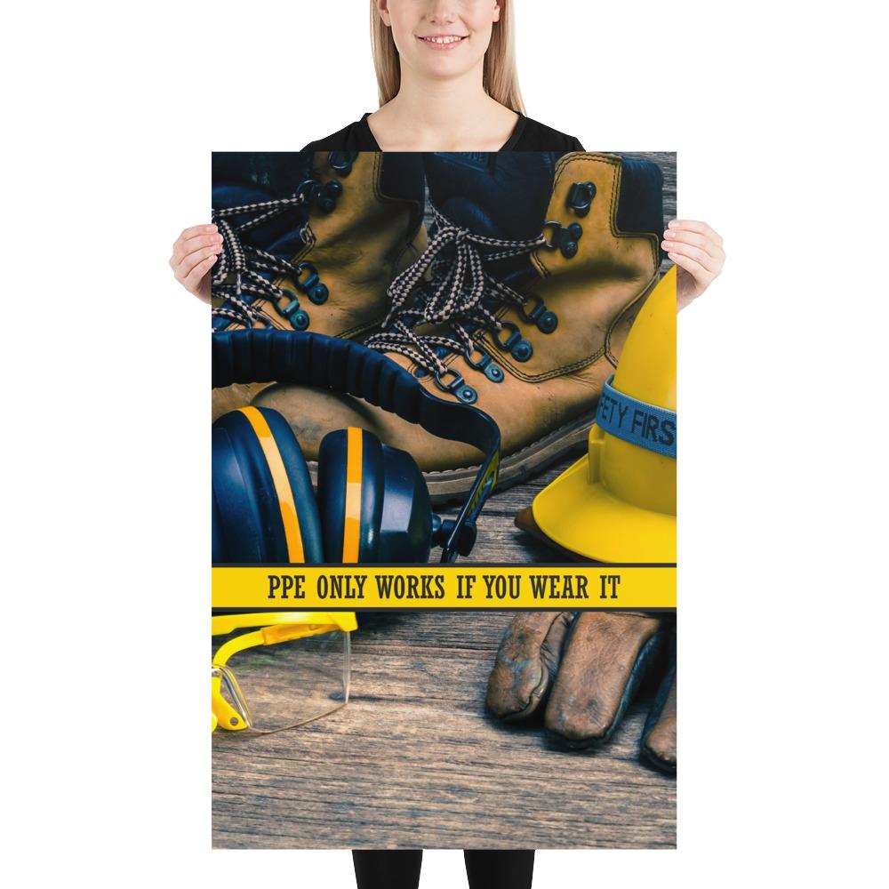 A safety poster showing a close-up of various PPE including safety glasses, ear muffs, gloves, a hard hat, and work boots with the slogan PPE only works if you wear it.