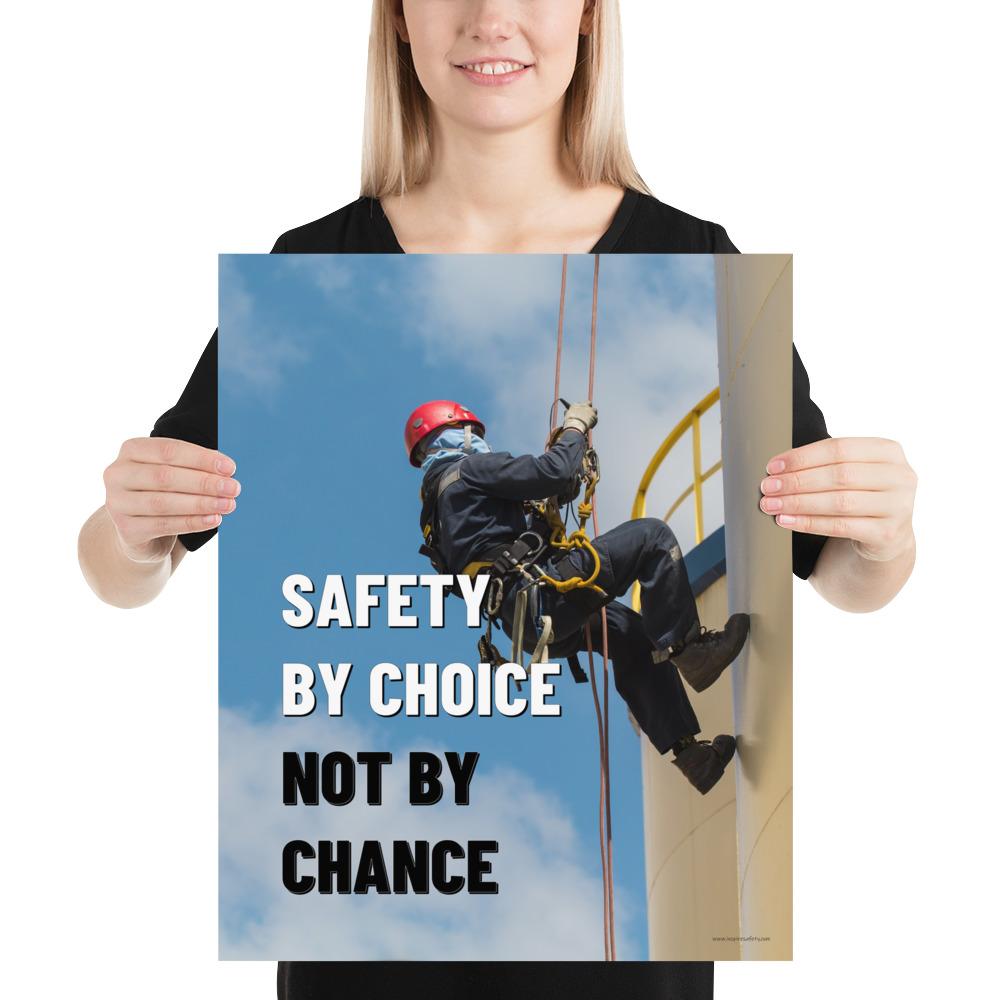 A fully harnessed man wearing a hard hat scaling the side of a building with a bright blue sky and clouds in the background with the text safety by choice, not by chance in bold text to his left.