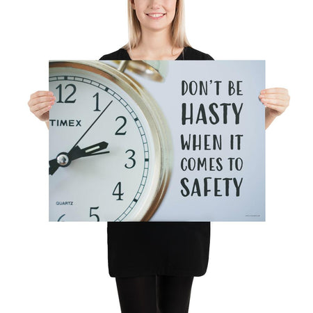 A workplace safety poster showing a close-up of a clock face with the slogan don't be hasty when it comes to safety.