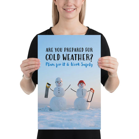 A safety poster showing two snowmen wearing hard hats and holding hand saws with the slogan are you prepared for cold weather? Plan for it and work safely.