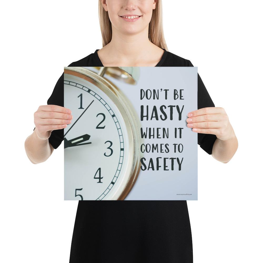 A workplace safety poster showing a close-up of a clock face with the slogan don't be hasty when it comes to safety.