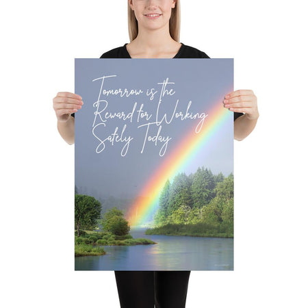 A workplace safety poster showing bright forest scene with a lake and vibrant green trees and a colorful rainbow coming out of the forest with the slogan tomorrow is the reward for working safely today.