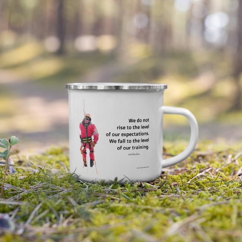 White metal mug with a silver rim with a quote by Archilochus that says "We do not rise to the level of our expectations. We fall to the level of our training." with a man in a safety harness to the side and the Inspire Safety logo on the other side.