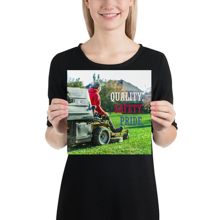 A workplace safety poster showing a man mowing a lawn on a sitting mower with the words quality, safety, pride in white, red, and blue, respectively.