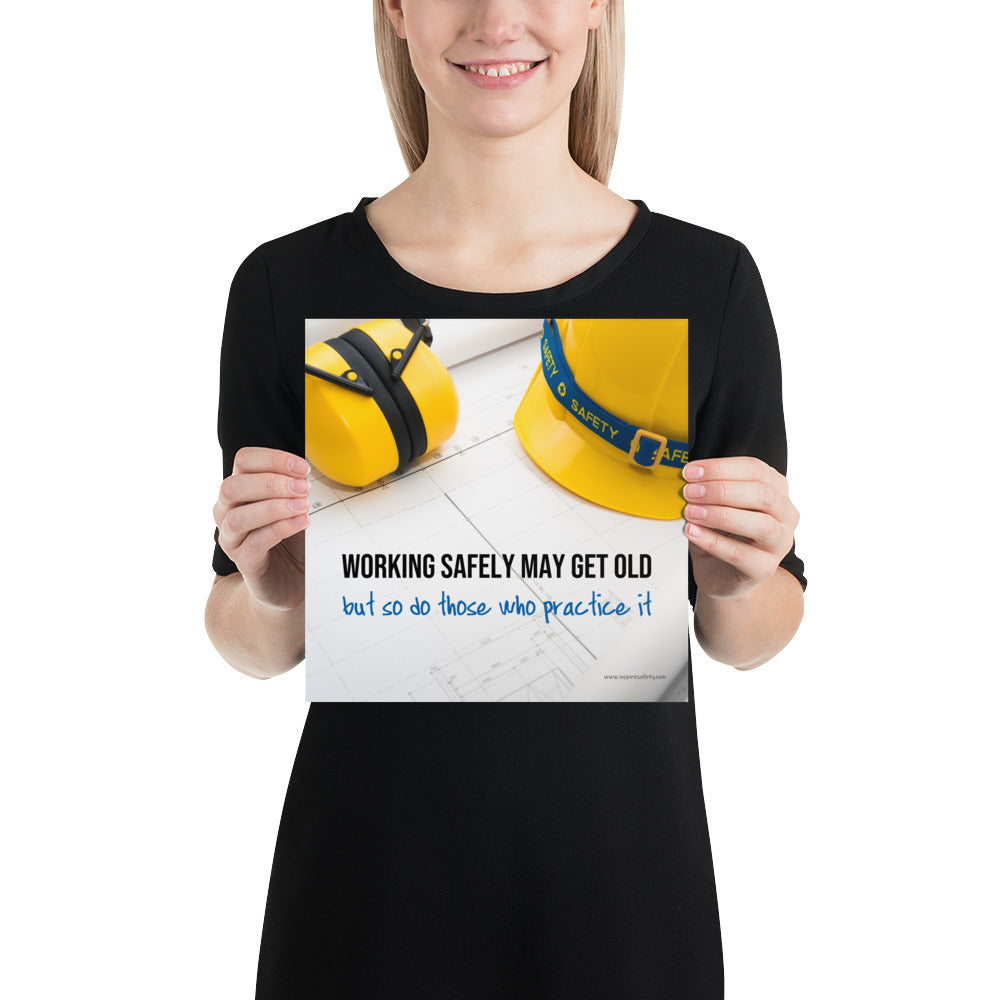 A construction safety poster showing yellow ear muffs and a hard hat resting on blueprints with the slogan "Working safely may get old, but so do those who practice it."