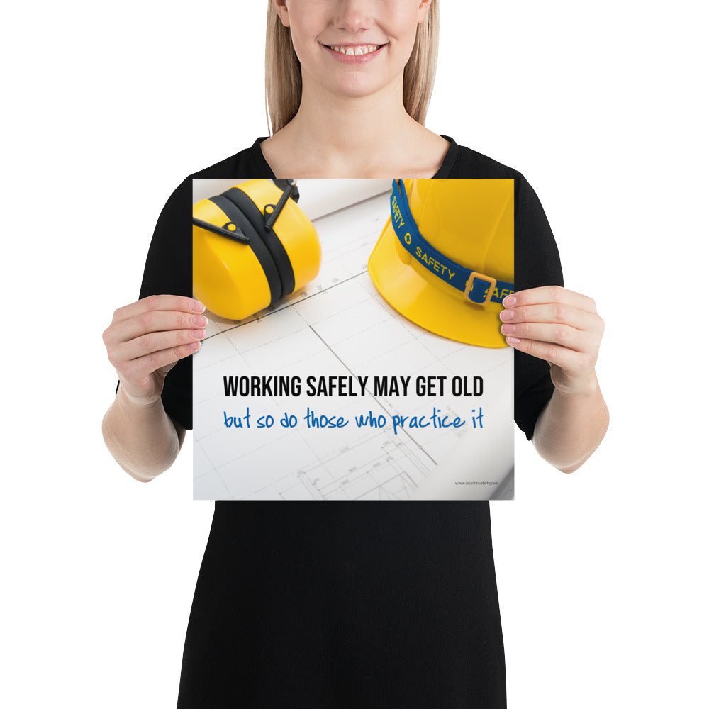 A construction safety poster showing yellow ear muffs and a hard hat resting on blueprints with the slogan "Working safely may get old, but so do those who practice it."